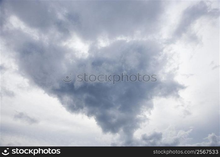 View of sky with large cumulus cloud formation.
