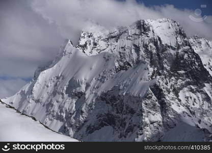 View of Snow Mountain Range Landscape with Blue Sky. Russia, Caucasus.