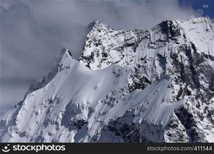 View of Snow Mountain Range Landscape with Blue Sky. Russia, Caucasus.