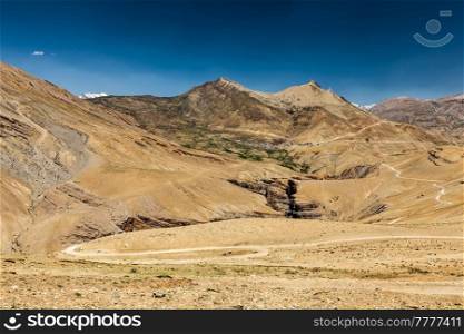 View of Spiti valley in Himalayas with Kibber village and road. Spiti valley, Himachal Pradesh, India. View of Spiti valley in Himalayas