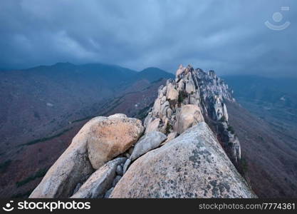 View of stones and rock formations from Ulsanbawi rock peak in stormy weather with clouds. Seoraksan National Park, South Corea. View from Ulsanbawi rock peak. Seoraksan National Park, South Corea