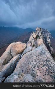 View of stones and rock formations from Ulsanbawi rock peak in stormy weather with clouds. Seoraksan National Park, South Corea. View from Ulsanbawi rock peak. Seoraksan National Park, South Corea