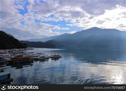 View of Sun Moon Lake with the passenger boats waiting at the numerous piers