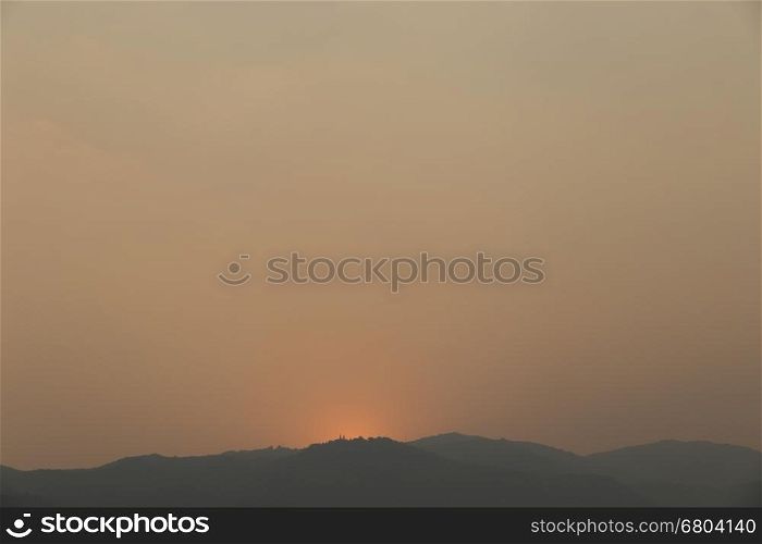 view of sunset on mountain hill