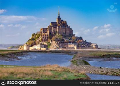 View of the Abbey Mont-Saint-Michel at sunset. France. Normandy.. Mont Saint-Michel at sunset.