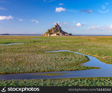 View of the Abbey Mont-Saint-Michel at sunset. France. Normandy.. Mont Saint-Michel at sunset.