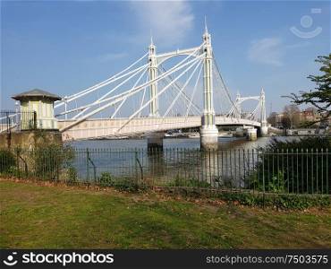 View of the Albert bridge from Battersea park inLondon, England, UK.. View of the Albert bridge, London, England.
