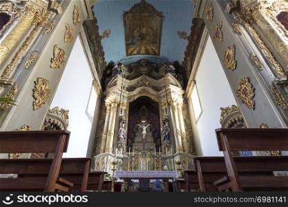 View of the altarpiece and ceiling of the central chapel of the Baroque Church of Saint Peter in the city of Gouveia, Beira Alta, Portugal