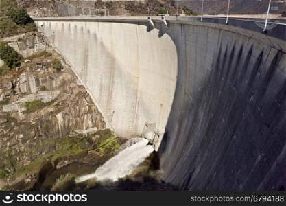 View of the Alto Lindoso Dam, a concrete double curvature arch dam on the Lima River, Portugal
