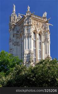 View of the ancient stone tower of Saint-Jacques on a sunny day. Paris. France.. Paris. Tower of Saint Jacques.