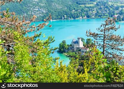View of the Annecy lake with castle in the French Alps