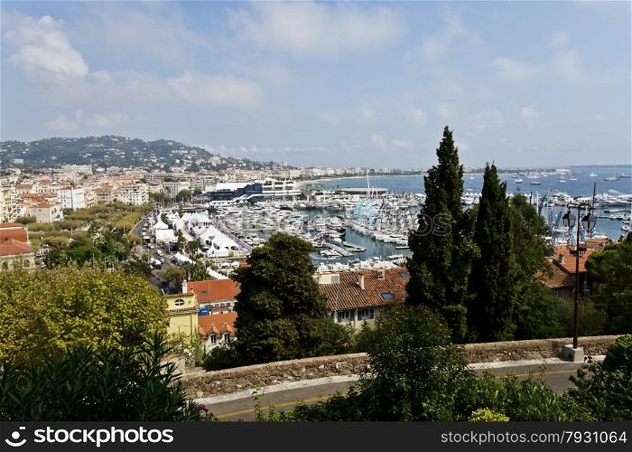 View of the Bay of Cannes from Le Suquet, the old quarter of the city of Cannes, a resort city with many luxury boutiques, restaurants, cafes, and hotels. Cannes is a city located on the French Riviera and host of the annual Cannes Film Festival.