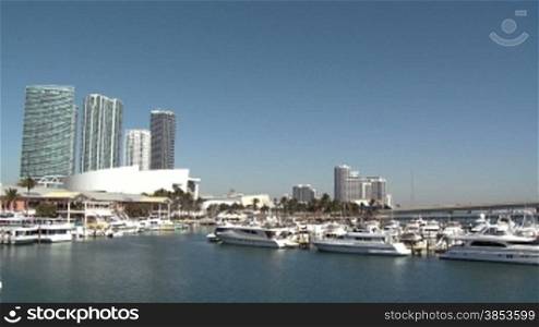View of the Bayside Marina in Miami with a lot of vessels on a sunny day.
