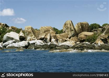 View of the beach flanked by rocks, Virgin Gorda, Virgin Islands
