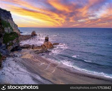 View of the beach of Portizuelo in Luarca, Asturias, Spain at sunset.
