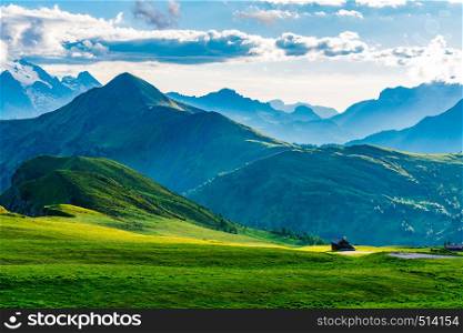 View of the beautiful mountain in the evening with Italian cottage in the evening light at Giau Pass in Belluno Italy