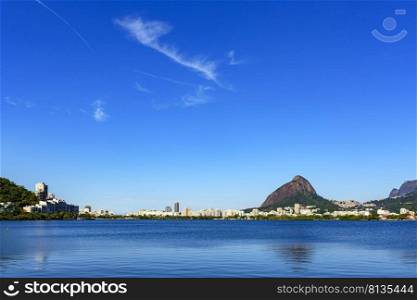 View of the beautiful Rodrigo de Freitas lagoon in Rio de Janeiro. One of the main tourist attractions surrounded by the mountains and buildings of the city. View of the beautiful Rodrigo de Freitas lagoon in Rio de Janeiro city