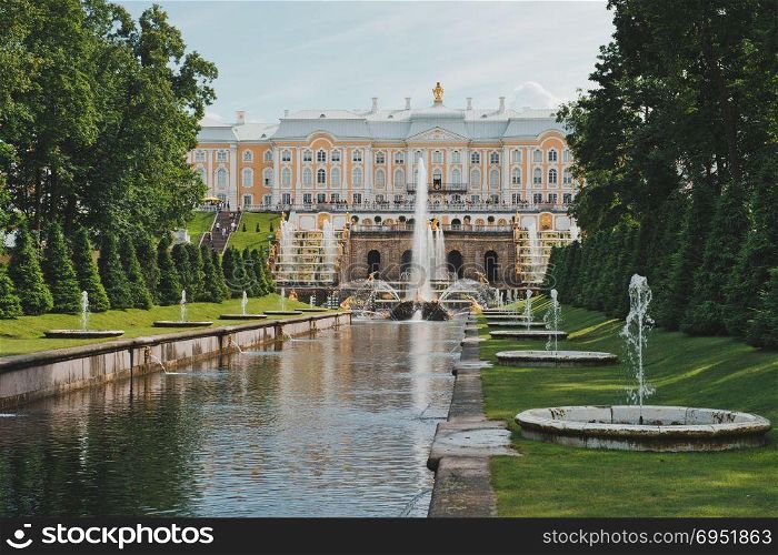 View of the Big Peterhof palace and the cascade of fountains from the sea near to the city of St. Petersburg.