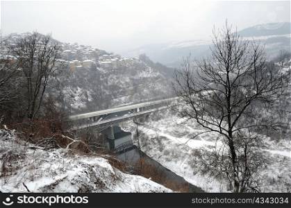 View of the bridge over the Yantra river in the city of Veliko Tarnovo in Bulgaria in the winter from Tsarevets fortress
