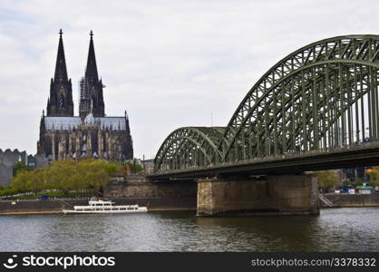 view of the cathedral of cologne and the hohenzollern bridge