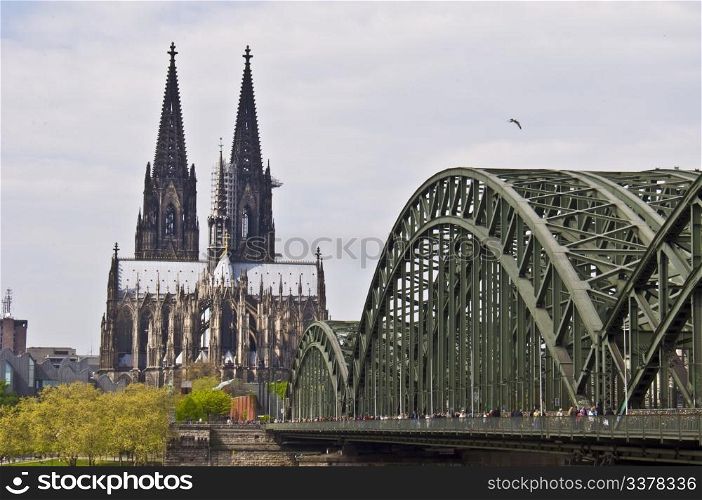 view of the cathedral of cologne and the hohenzollern bridge