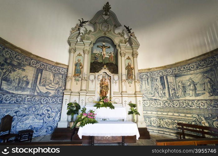 View of the chapel rococo style altarpiece with a statue of Our Lady holding the Child Jesus In Vila do Conde, Portugal