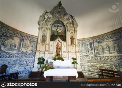 View of the chapel rococo style altarpiece with a statue of Our Lady holding the Child Jesus In Vila do Conde, Portugal