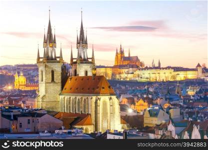 View of the Church of Our Lady before Tyn and St. Vitus Cathedral at sunset.. Prague. View of the city at sunset.