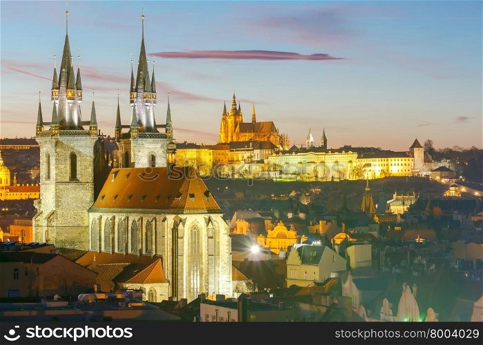 View of the Church of Our Lady before Tyn and St. Vitus Cathedral at sunset.. Prague. View of the city at sunset.