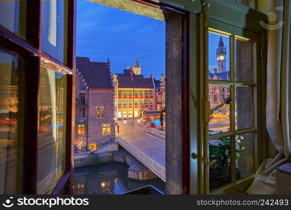 View of the city embankment and facades of medieval houses at sunset. Gent. Belgium.. Gent. City embankment at sunset.