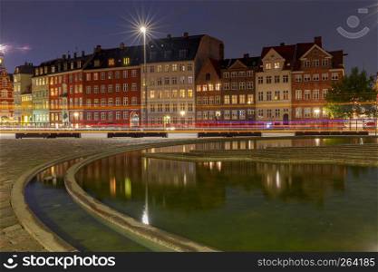 View of the city embankment in the night lighting. Copenhagen. Denmark.. Copenhagen. City embankment at night