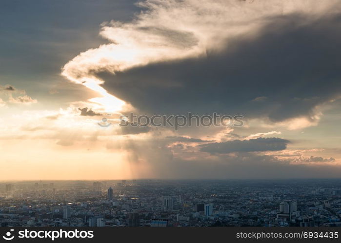 view of the city of Bangkok from a skyscraper, heavy cloud over the city