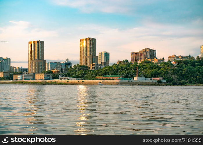 View of the city of Khabarovsk from the Amur river. Urban landscape in the evening at sunset. View of the city of Khabarovsk from the Amur river. Urban landscape in the evening at sunset.