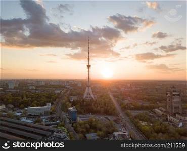 view of the city of Kiev with Dorogozhychi distric with a TV tower on sunset, Ukraine. Drone photo. view of the city with a TV tower in Kiev on a beautiful sunset.