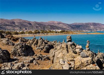 View of the city of Malia with the beaches and mountains north of the island of Crete in Greece