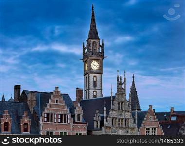 View of the clock tower of the post office at sunset. Gent. Belgium.. Gent. Clock tower at sunset.