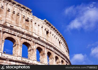 View of the Colosseum in Rome, Italy. Blue sky.