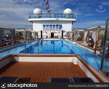 View of the cruise ship deck with luxurious pool and spa area