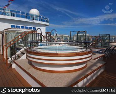 View of the cruise ship deck with luxurious pool and spa area