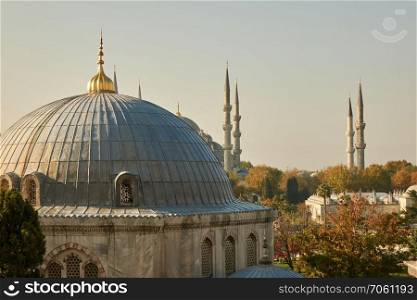 View of the dome and the tower of the mosque against the sky. Turkey, Istanbul. Dome and tower of the mosque. Turkey, Istanbul
