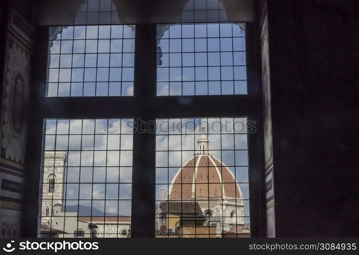 View of the dome of the cathedral of florence from a stately medieval window