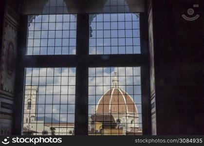 View of the dome of the cathedral of florence from a stately medieval window