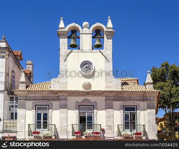 View of the double bell clock tower in the municipality centre of the charming coastal town of Cascais, Portugal