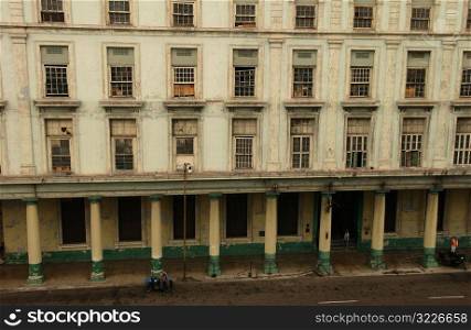 View of the facade of a dilapidated commercial building, Havana, Cuba