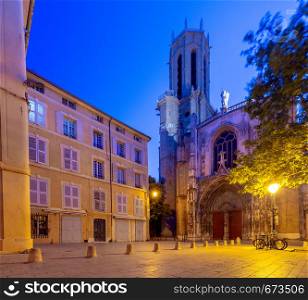 View of the facade of the old Catholic cathedral in the night lighting. France. Provence. Aix-en-Provence.. Aix-en-Provence. The facade of the old catholic cathedral at sunrise.