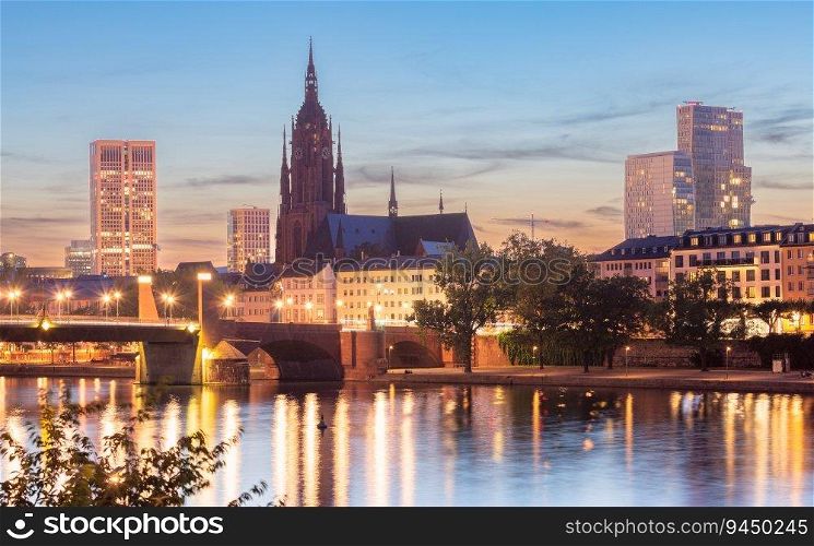 View of the famous Frankfurt St. Bartholomew’s Cathedral and the river Main at sunset. Germany.. Frankfurt St. Bartholomew’s Cathedral and city embankment at sunset.