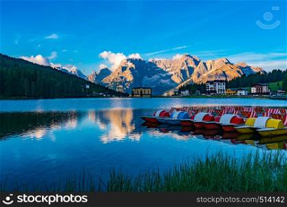 View of the famous Lake Misurina in the morning with colorful boat and the Dolomites Mountain at Cortina d'Ampezzo in Italy