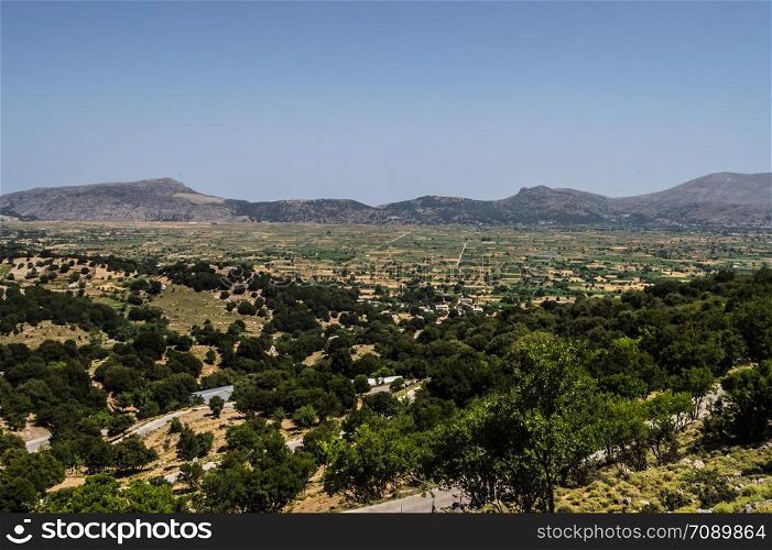 View of the fertile Lassithi Plateau in Crete. Panoramic view of the Lassithi Plateau in Crete, Greece