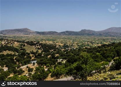 View of the fertile Lassithi Plateau in Crete. Panoramic view of the Lassithi Plateau in Crete, Greece