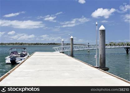 View of the floating dock and ramp of the new recreational pier at the Pumicestone Passage &#xA;near the bridge to the Bribie Island, Queensland, Australia&#xA;